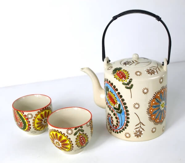 Photograph of a bohemian ceramic tea set to showcase round table decor ideas