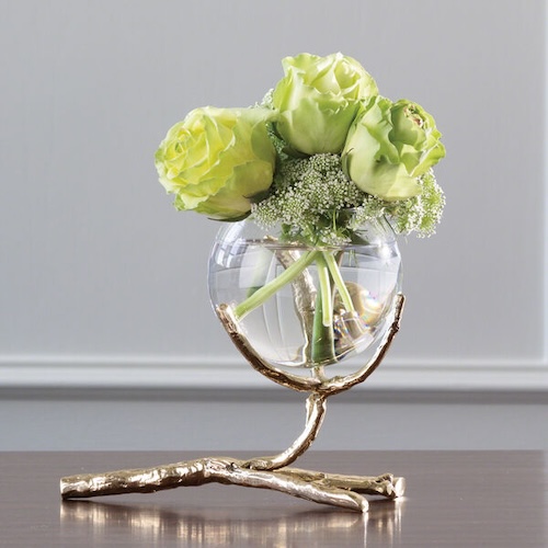 Photograph of brass vase holder resembling a twig to demonstrate fall floral decor