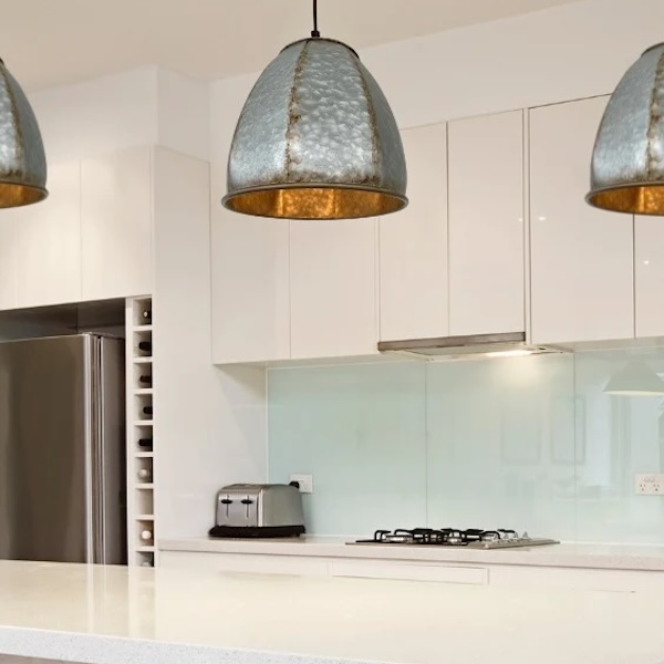 Galvanized steel pendant lamp to demonstrate what goes well with sunflower decor in a Modern Rustic kitchen.