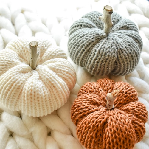 Photograph of knitted pumpkins to demonstrate decor that goes with white farmhouse curtains