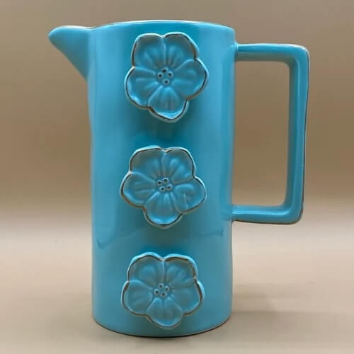 Rustic pitcher vase in a bright turquoise blue to demonstrate decor for a modern rustic kitchen