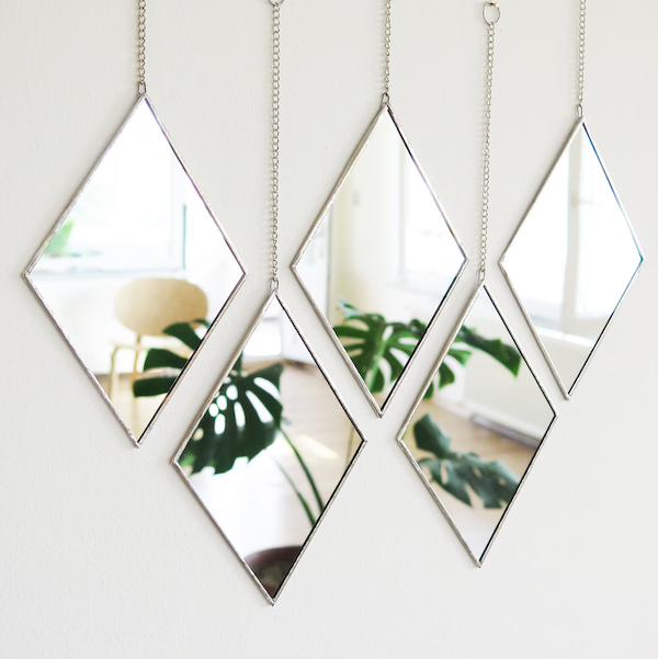 Hanging diamond mirror fixture as part of a list of narrow living room ideas